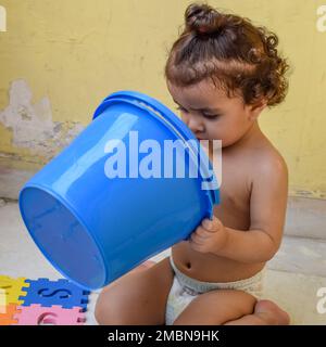 Cute little boy Shivaay Sapra at home balcony during summer time, Sweet little boy photoshoot during day light, Little boy enjoying at home during pho Stock Photo