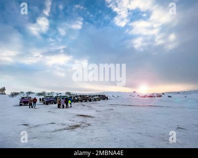 Travel destination concept: Volcanic rock formation in Cappadocia, Central Anatolia, Turkey. Historical area covered with snow. Winter landscape Stock Photo