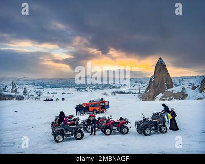 Travel destination concept: Volcanic rock formation in Cappadocia, Central Anatolia, Turkey. Historical area covered with snow. Winter landscape Stock Photo