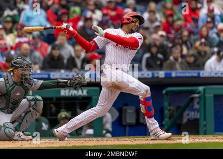 Philadelphia Phillies third baseman Johan Camargo holds his glove out after  catching a line out by Texas Rangers' Adolis Garcia in the fourth inning of  a baseball game, Tuesday, June 21, 2022