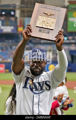 Tampa Bay Rays' Randy Arozarena holds up the Jackie Robinson Award after  winning the 2021 American League Rookie of the Year before a baseball game  against the Baltimore Orioles Saturday, April 9