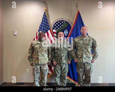 Col. Samuel Hunter and Command Sgt. Maj. Ira Ford, 658th Regional Support Group Commander and Command Sergeant Major pose for a photo with Rear Adm. Benjamin Nicholson, the Commander of Joint Region Marianas. Stock Photo