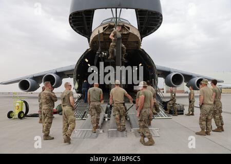 The 1st Attack Reconnaissance Battalion, 211th Aviation Regiment, Utah National Guard, load four AH-64D Apache helicopters onboard a C-5 Galaxy, to be transported to Morocco in support of African Lion 22, a U.S. Africa Command annual exercise on Saturday, June 18, 2022.     The 1-211th ARB aircraft maintaniners prepped the aircraft for loading onto the C-5 by folding the blades and then members of the 151st Air Refueling Wing, Utah Air National Guard, assisted in loading and securing the helicopters on the C-5 from Travis Air Force Base, California, for transportation to Morocco. Stock Photo