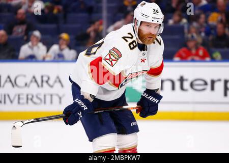 Linesman Vaughan Rody (73) hugs Florida Panthers right wing Claude Giroux  (28) after Panthers defeated the