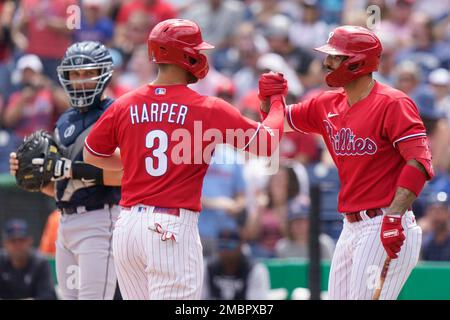 Philadelphia Phillies' Bryce Harper (3) reacts after Nick Castellanos (8)  hit a two-run home run during the first inning a spring training baseball  game against the Baltimore Orioles, Monday, March 28, 2022