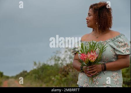 Side view of woman with curly hair Stock Photo