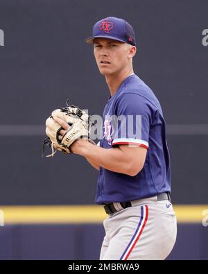 Texas Rangers starting pitcher Glenn Otto throws during the first inning of  a spring training baseball game against the Seattle Mariners Monday, March  28, 2022, in Peoria, Ariz. (AP Photo/Charlie Riedel Stock