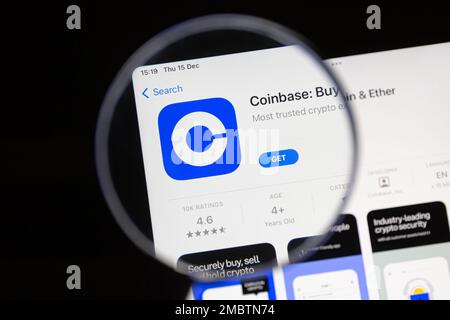 Ostersund, Sweden - Dec 15, 2022: Coinbase app under a magnifying glass. Coinbase is an American company that operates a cryptocurrency exchange platf Stock Photo