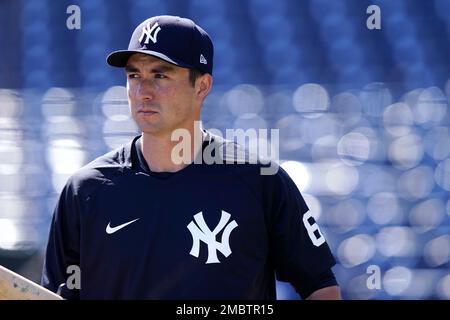 BALTIMORE, MD - AUGUST 7 New York Yankees catcher Kyle Higashioka (66) is  congratulated in the dugout after hitting a three run home run in the  fourth inning during the game between