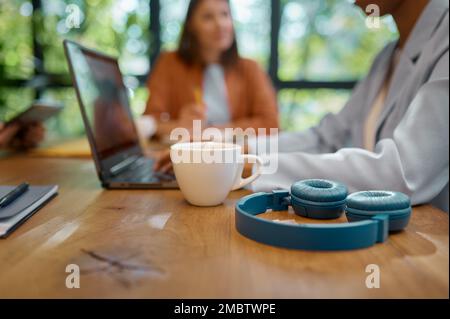 Young entrepreneurs collaborating on new project at coworking space Stock Photo