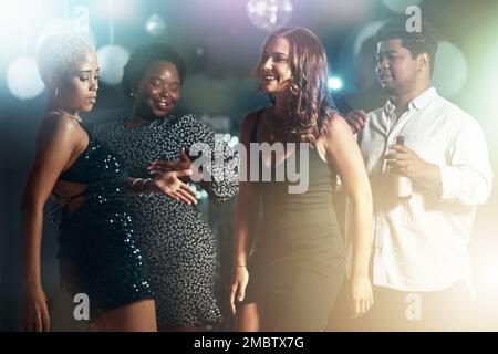 People, diversity or dancing on dance floor in party, nightclub event or bokeh disco for birthday celebration. Smile, happy or dancer friends bonding Stock Photo