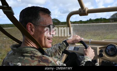 U.S. Air Force Lt. Gen. Marc Sasseville, the 12th vice chief of the National Guard Bureau, drives a light tactical all-terrain vehicle, MZRZ, during a tour on Andersen Air Force Base, Guam, June 22, 2022. During his visit, Sasseville presented an award during a ceremony to the Guam Army National Guard for their COVID-19 response, toured the island and had discussions on the current operation plan and impacts to Guam. Stock Photo