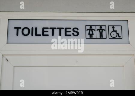 Toilettes french text means wc Toilet sign on wooden arrow water ...