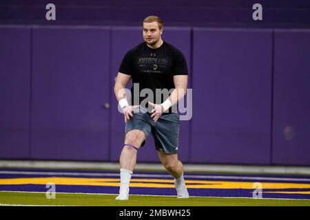 Northern Iowa offensive lineman Trevor Penning stretches before a drill at  an NCAA college football pro day, Monday, March 21, 2022, in Cedar Falls,  Iowa. (AP Photo/Charlie Neibergall Stock Photo - Alamy