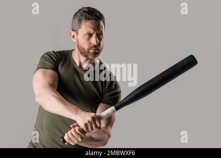 aggression of angry criminal man with bat in studio. photo of angry man hold bat. Stock Photo