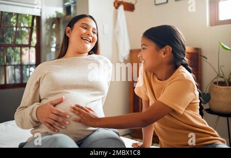 Family, baby and pregnant mother in home with excited, happy and joyful smile of kid touching belly. Indian mom and child waiting for baby sibling and Stock Photo