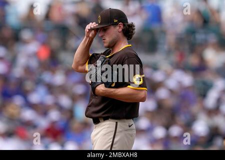 A Chicago Cubs spring training cap sits on the bench during the