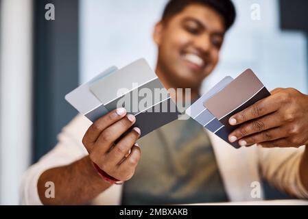 If anything can give a design character, colour will. a young architect deciding on a colour scheme while working on a project. Stock Photo