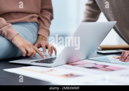A strong marriage makes for a profitable partnership. an unrecognisable man and woman using a laptop while working from home. Stock Photo