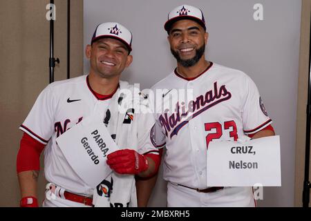 Washington Nationals' Nelson Cruz, left, walks past Texas Rangers starting  pitcher Dane Dunning, right, on his way to the dugout after being thrown  out at home while trying to score on a