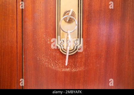 Detail of a door lock scratched by keys Stock Photo