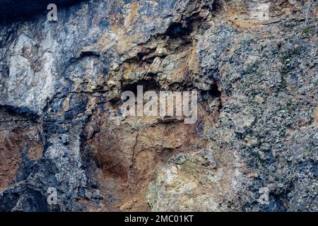 Colorfull stone wall containing minerals. Stock Photo