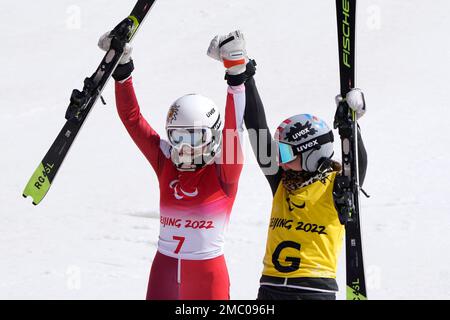 Veronika Aigner of Austria and guide Elisabeth Aigner celebrate