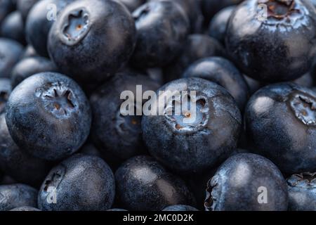 Raw blueberries macro background. Closeup texture of sweet juicy wildberries. Ripe blueberry as natural antioxidant for vitamin healthy eating. Macro. Stock Photo