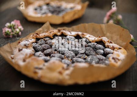 Homemade berry pie with fresh berries on wooden table, closeup. top view. Stock Photo