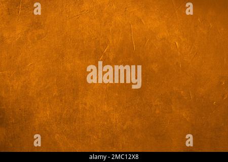 Golden plaster wall grunge background Stock Photo