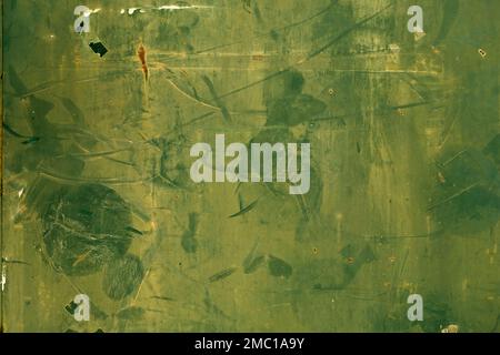 Old green painted rusty metal plate, grunge background Stock Photo