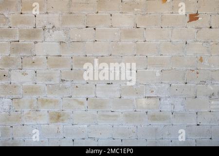Old brick wall white wash plaster grunge background Stock Photo