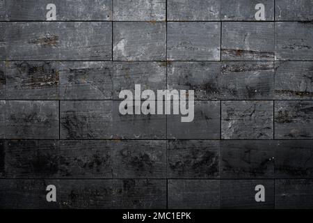 Slate effect porceliain tiles wall cladding, architecture detail background Stock Photo