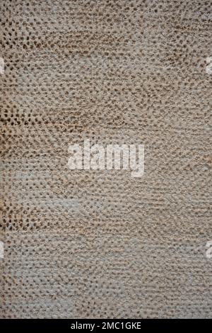 Decorative relief plaster finish wall texture, rough surface, architecture detail Stock Photo