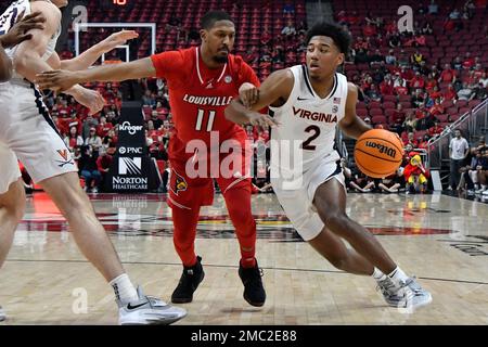 Charlottesville, Virginia, USA. 24th Jan, 2022. Louisville Cardinals guard  Mason Faulkner (11) shoots over Virginia guard Kihei Clark (0) during NCAA  basketball game between the Virginia Cavaliers and the Louisville Cardinals  at