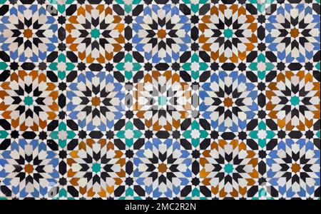 textures of ancient moroccan ceramic mosaic with geometric and floral pattern Stock Photo