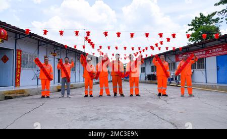 Bandung, Indonesia. 21st Jan, 2023. Construction workers of the Jakarta-Bandung High-Speed Railway display Spring Festival couplets after work in celebration of the upcoming Chinese Lunar New Year in Bekasi, Indonesia, Jan. 21, 2023. Credit: Xu Qin/Xinhua/Alamy Live News Stock Photo
