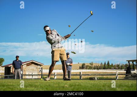 Capt. Tyler Jackson takes a practice swing during a charity golf tournament hosted by AFA on June 24, 2022 at the Spring Valley Golf Club in Elizabeth, Colo. Players worked in teams of four to win various awards and raffle prizes while competing in contests consisting of closest to the pin, longest drive and a hole in one contest. Stock Photo