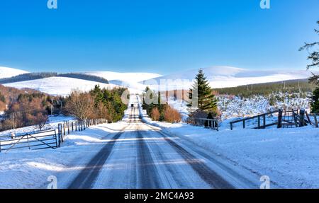 Tomintoul Moray Scotland Glenlivet Estate the old Military Road A 939 in winter and snow covered hills Stock Photo