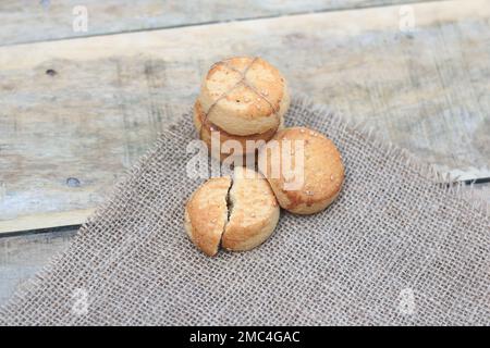 Broken half biscuits cooking food,Stack biscuit cookies a wooden background. Stock Photo