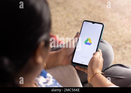 Birbhum, West Bengal, India - December 27th 2022: An Indian woman with smart phone google pay application at home Stock Photo