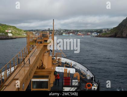 The crew of U.S. Coast Guard Cutter Oak pulls into St. John's Harbour in Newfoundland, Canada, June 25, 2022. The port call enabled the crew to restock and explore the area before continuing in support of the annual Exercise Argus. U.S. Coast Guard photo by Petty Officer 2nd Class Diana Sherbs. Stock Photo
