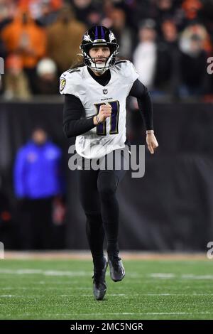 Baltimore Ravens punter Jordan Stout (11) runs off the field at halftime of  an NFL football game against the New England Patriots, Sunday, Sep. 25,  2022, in Foxborough, Mass. (AP Photo/Stew Milne