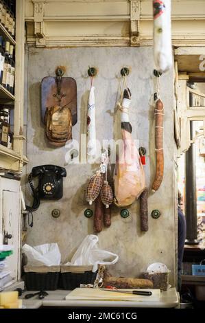 Ham and old fashioned telephone at the 'Rinconcillo' Restaurant in Sevilla. Stock Photo