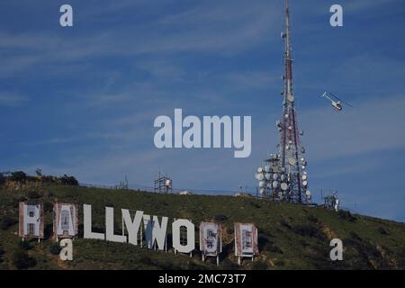 Workers transform the Hollywood sign to read Rams House in Los Angeles on  Monday, Feb. 14, 2022. The Hollywood Chamber of Commerce and the Hollywood  Sign Trust allowed for making the change