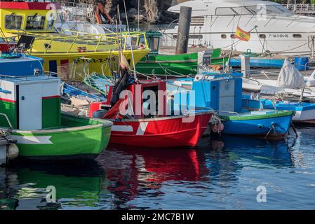Brightly coloured fishing boats in harbour, Puerto del Carmen, Lanzarote, Canary Islands, Spain Stock Photo
