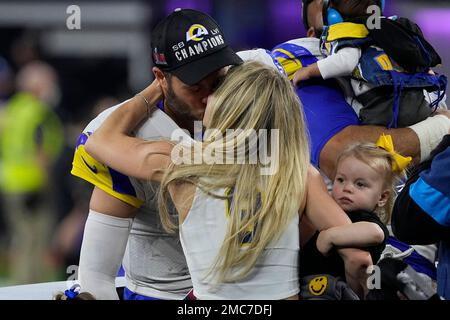 Matthew Stafford kisses wife Kelly while holding Lombardi Trophy