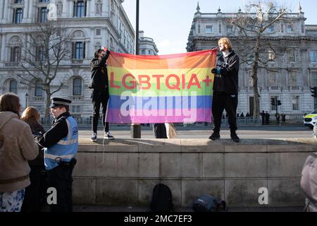 London, UK. 21st Jan, 2023. Protesters hold an LGBTQ  flag outside Downing Street during a rally in opposition to the governments triggering of Section 35. (Photo by Mike Ruane/SOPA Images/Sipa USA) Credit: Sipa USA/Alamy Live News Stock Photo