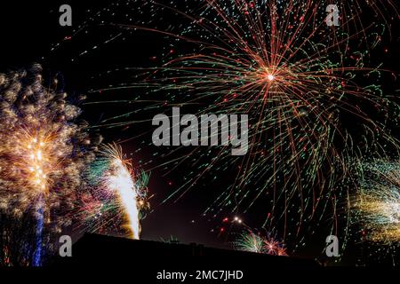 Fireworks exploding in the night sky Stock Photo