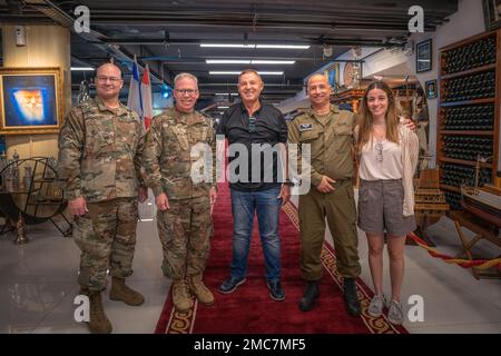 (Left to Right) U.S. Army Command Chief Warrant Officer 5 Wesley Dohogn, Maj. Gen. Greg Brady, Commanding General of the 10th Army Air and Missile Defense Command, Mr. Moshe Levy, Israeli Defense Forces Brig. Gen. Doron Gavish and his daughter pose for a photo during a meeting on June 26, 2022, in Tel Aviv, Israel. Mr. Levy received the Medal of Valor for his actions in Sinai during the Yom Kippur War in 1973. Maj. Gen. Brady had the honor of meeting Mr. Levy while in town to meet with Israeli Defense Force counterparts. Stock Photo